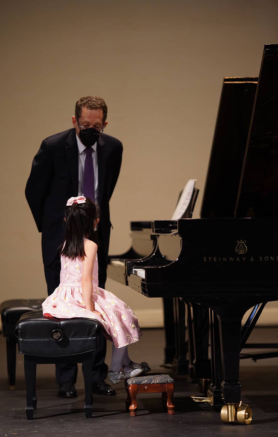 student at piano