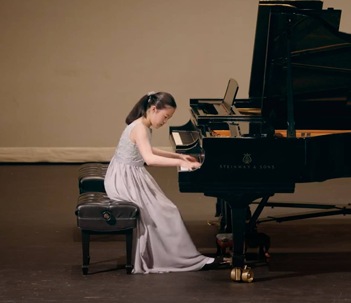 girl playing piano